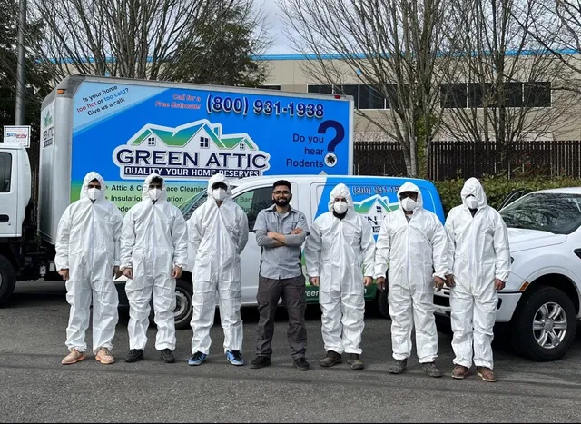 Green Attic crew and owner Sadeq in front of branded company van